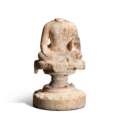 View full screen - View 1 of Lot 9575. A marble torso of a seated Buddha, Tang dynasty | 唐 大理石蓮座佛身像.