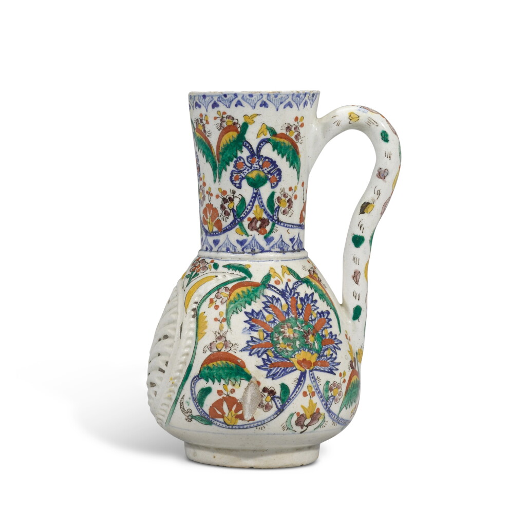 View full screen - View 1 of Lot 94. A large Kütahya polychrome pottery jug with moulded decoration, Turkey, 18th century.