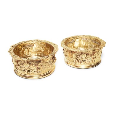 View full screen - View 1 of Lot 48. A Rare Pair of Regency Silver-Gilt "Teniers Pattern" Decanter Coasters, Edward Farrell, London, 1819.