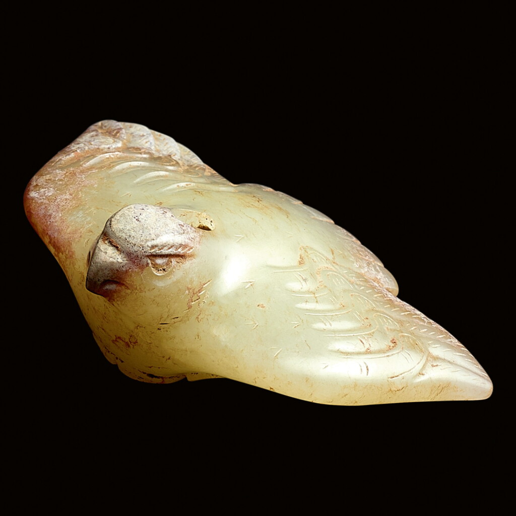 View full screen - View 1 of Lot 94. A RARE CELADON JADE FIGURE OF AN EAGLE IN FLIGHT WESTERN HAN DYNASTY | 西漢 青白玉鷹.