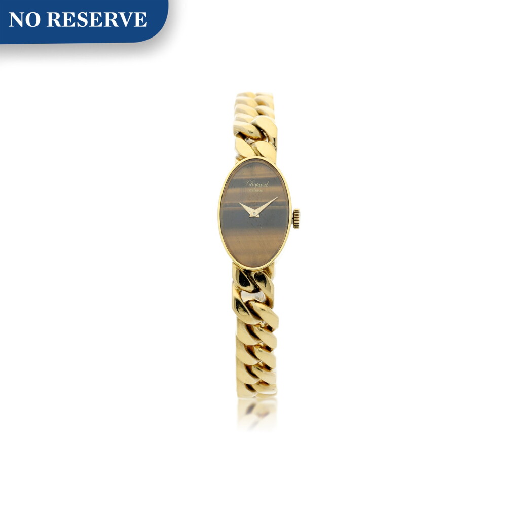 View full screen - View 1 of Lot 221. REFERENCE 5026/1 A LADY'S YELLOW GOLD BRACELET WATCH WITH TIGER EYE DIAL, CIRCA 1990’S.
