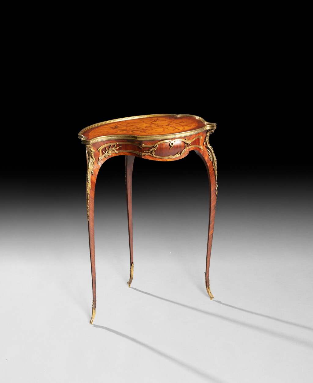 View full screen - View 1 of Lot 178. A French gilt-bronze mounted kingwood, satiné, holly and hornbeam marquetry "Coquille" table by François Linke, index number 544, circa 1900 | Table à ouvrage "Coquille" en placage de bois de violette, satiné, marqueterie de houx et charme teintés et bronze doré par François Linke, numéro d'index 544, vers 1900.