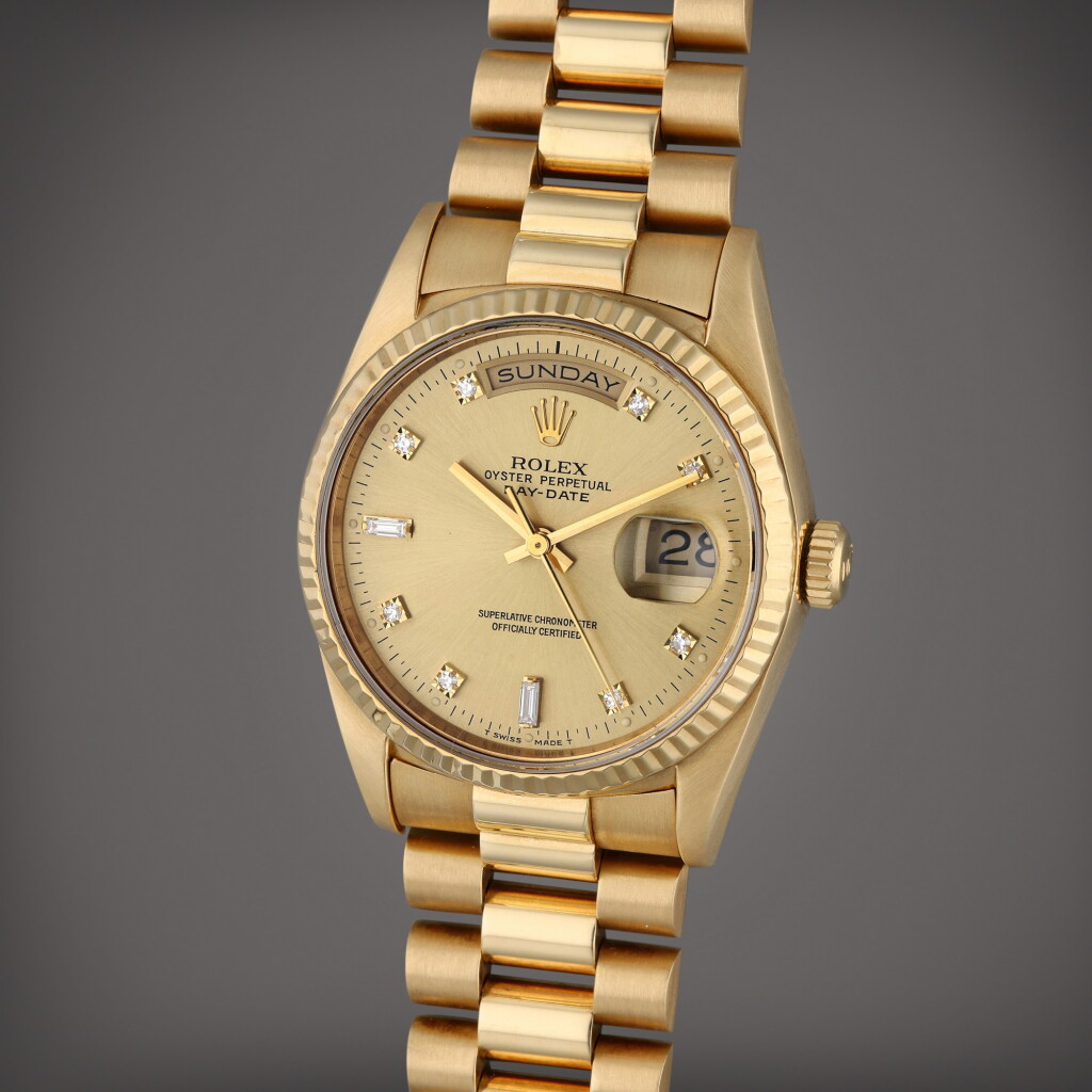 View full screen - View 1 of Lot 418. Reference 18238 Day-Date | A yellow gold and diamond-set automatic wristwatch with day, date, and bracelet, Circa 1991.