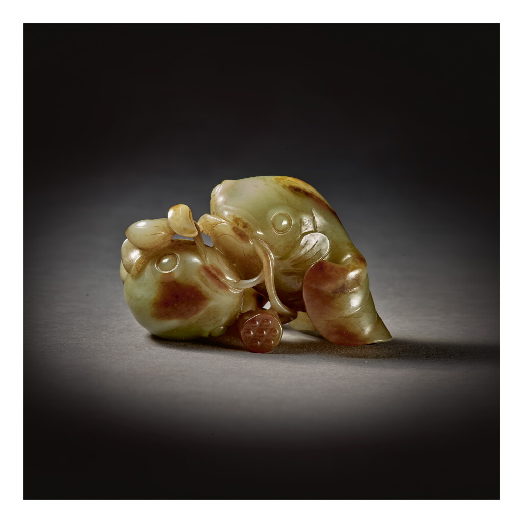 View full screen - View 1 of Lot 215. A GREEN AND RUSSET JADE 'GOLDFISH' GROUP, 17TH / 18TH CENTURY.