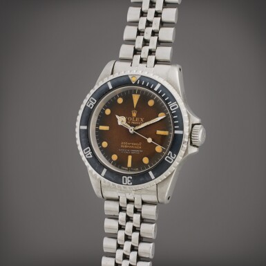 View full screen - View 1 of Lot 63. Reference 5512 Submariner | A stainless steel automatic wristwatch with tropical gilt dial and bracelet, Circa 1966.