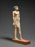 An Egyptian Polychrome Wood Figure of a Man, 11th-12th Dynasty, 2081-1759 B.C.