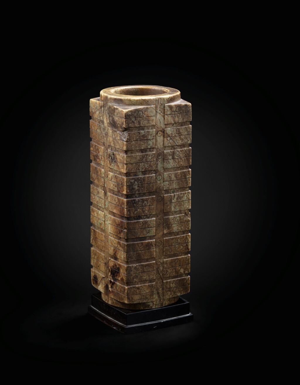 View full screen - View 1 of Lot 29. A large mottled brown jade nine-tier archaistic cong Ming dynasty or earlier | 明或更早期 青玉琮.