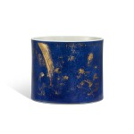 A powder-blue ground gilt-decorated 'Four Accomplishments' brushpot, Qing dynasty, Kangxi period 清康熙 灑藍釉描金四藝圖筆筒
