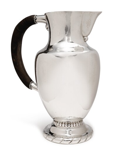 View full screen - View 1 of Lot 211. A DANISH SILVER PITCHER, NO. 5A, DESIGNED BY GEORG JENSEN, GEORG JENSEN SILVERSMITHY, COPENHAGEN, CIRCA 1925-32.