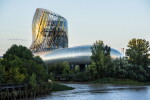 Wine and Dine Experiences | La Cité du Vin, Bordeaux, France | An exceptional Bordeaux discovery stay, including a VIP tour of the Cité du Vin, lunch at the panoramic restaurant "Le 7", a wine-paired dinner at the renowned "Le Chapon Fin", an overnight stay at the 5-star "Grand Hôtel de Bordeaux" with Guerlain spa access, lunch at "Le Bordeaux", and a private guided tour of the historic city, for 2 guests/1 couple