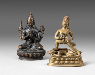 View full screen - View 1 of Lot 128. A bronze figure of Tsongkhapa lama and a brass-alloy figure of Kala Jambhala Qing dynasty, 18th-19th century | 清十八至十九世紀 銅宗喀巴喇嘛坐像及合金黃銅布祿金剛贍巴拉立像一組兩尊.