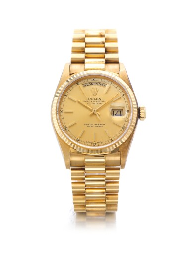 View full screen - View 1 of Lot 55. ROLEX | REF 18038 DAY-DATE, A YELLOW GOLD AUTOMATIC CENTER SECONDS WRISTWATCH WITH DAY DATE AND BRACELET CIRCA 1984.