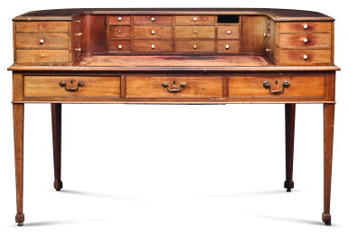 View full screen - View 1 of Lot 116. A REGENCY MAHOGANY CARLTON HOUSE DESK, CIRCA 1803, AFTER A DESIGN BY GEORGE HEPPLEWHITE.