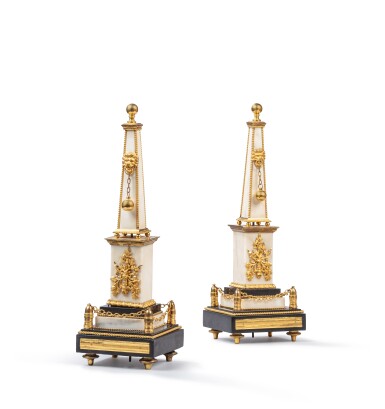 View full screen - View 1 of Lot 410. A pair of French gilt-bronze mounted white marble and black marble obelisks, late 18th-early 19th century.
