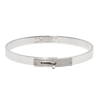 View full screen - View 1 of Lot 54. Hermès 18-Karat White Gold Diamond Encrusted Kelly Bracelet Size Large.