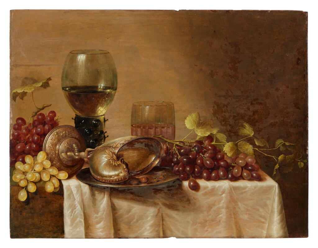 View full screen - View 1 of Lot 99. Still Life with an Overturned Nautilus Cup, Roemer of Wine, Glass Tumbler, and Grapes.
