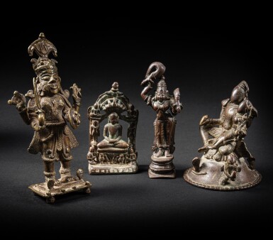 View full screen - View 1 of Lot 24. A group of ten bronze figures of deities and ritual implements, India, 14th - 19th century.