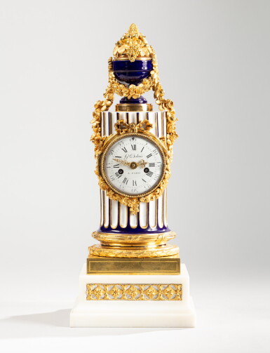 View full screen - View 1 of Lot 28. A Louis XVI gilt-bronze mounted Sèvres porcelain clock | Pendule colonne en porcelaine de Sèvres et montures de bronze doré d’époque Louis XVI.