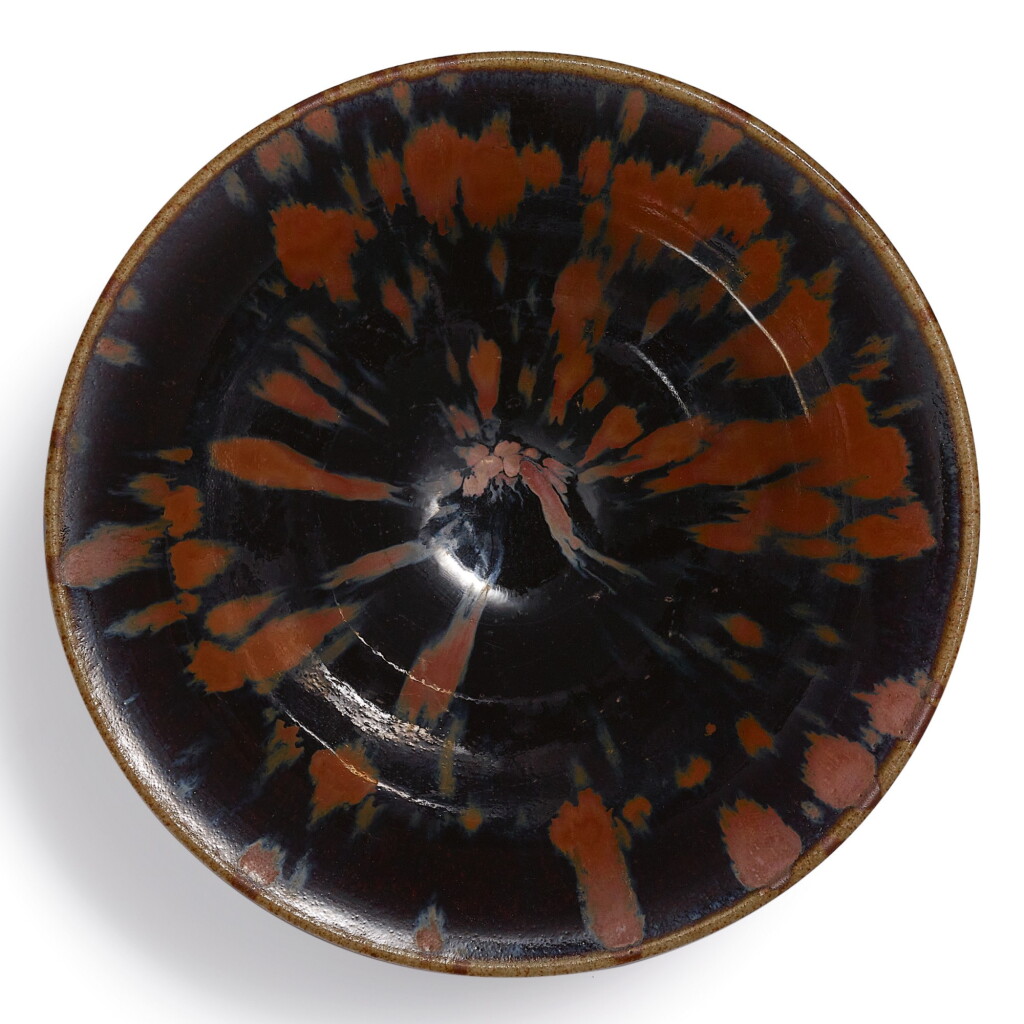 View full screen - View 1 of Lot 65. A RUSSET-SPLASHED BLACK-GLAZED 'PARTRIDGE FEATHER' BOWL NORTHERN SONG DYNASTY | 北宋 黑釉鐵鏽飛斑天目盞.
