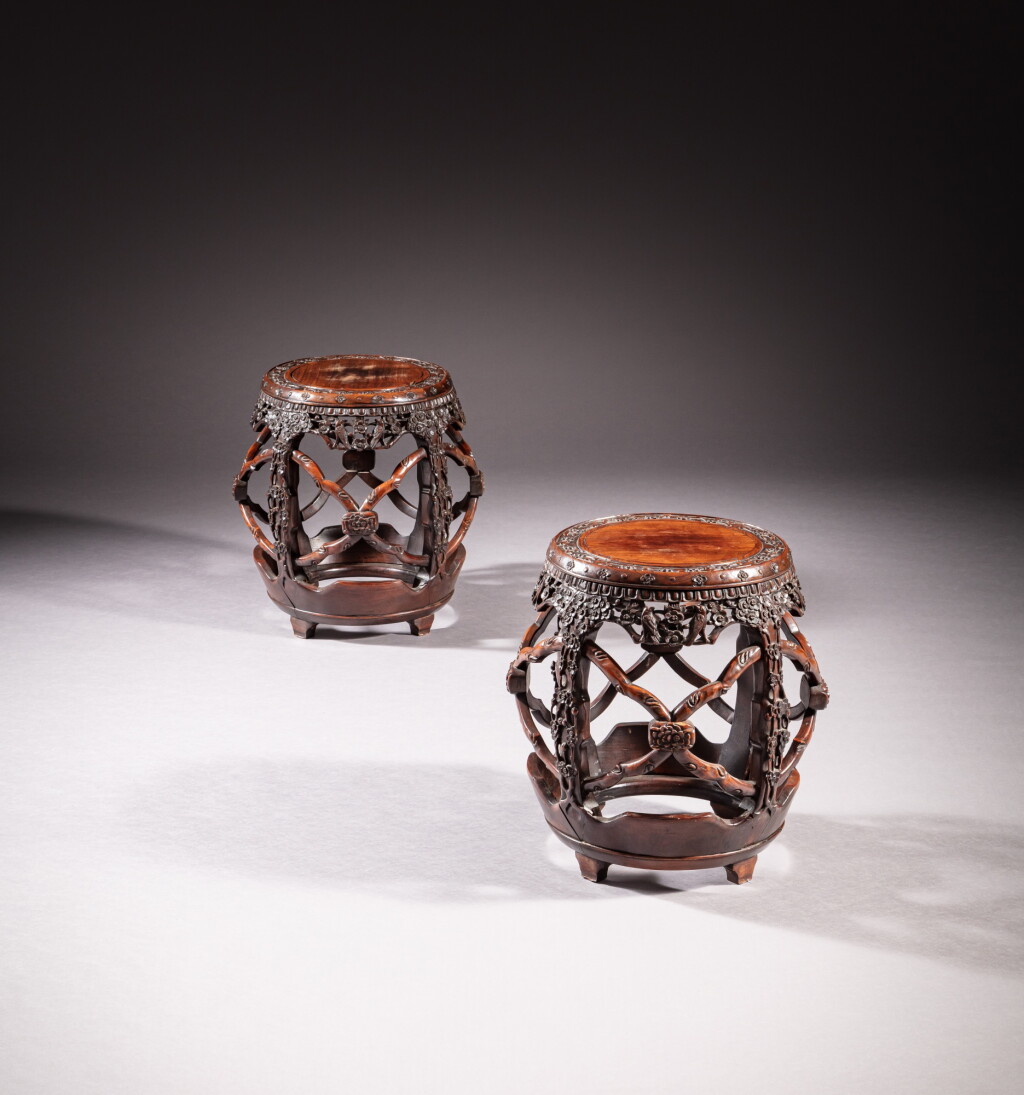 View full screen - View 1 of Lot 52. Two ‘hongmu’ ‘prunus’ barrel-shaped stools, Qing dynasty, 19th century | 清十九世紀 紅木梅花紋坐墩一組兩件.