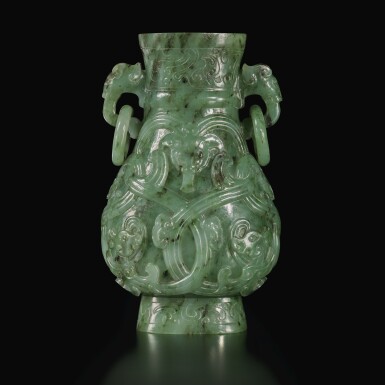 View full screen - View 1 of Lot 176. An archaistic spinach-green jade hu-form vase, Qing dynasty, 18th / 19th century | 清十八 / 十九世紀 碧玉雕仿古螭龍紋雙耳活環壺.