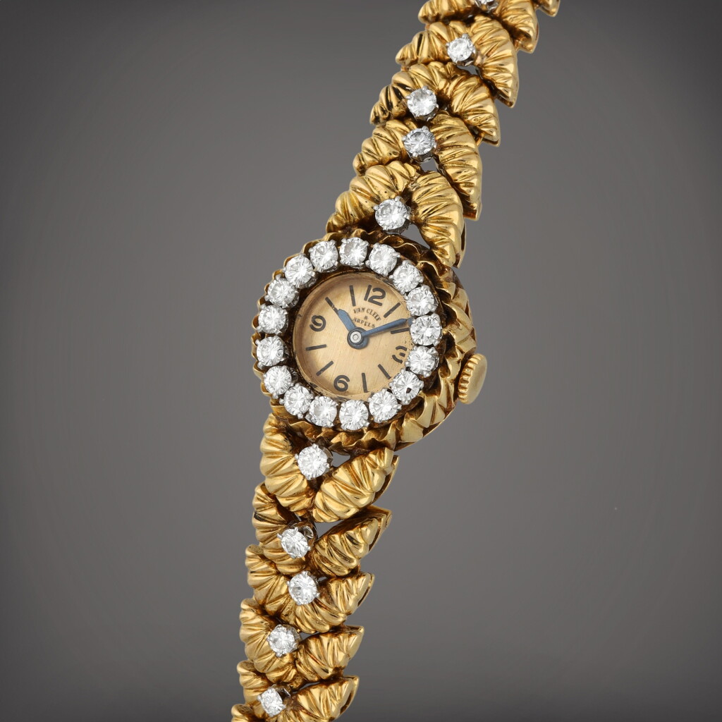 View full screen - View 1 of Lot 60. A yellow gold and diamond-set bracelet watch | Circa 1950.