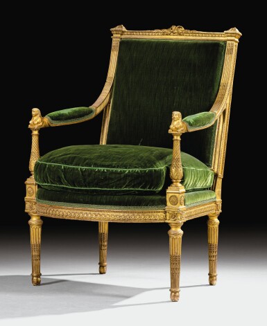 View full screen - View 1 of Lot 18. A CARVED GILTWOOD ARMCHAIR WITH SPHINXES, LOUIS XVI, BY MATHIEU DE BAUVE, CIRCA 1785 | FAUTEUIL AUX SPHINGES EN BOIS SCULPTÉ ET DORÉ D'ÉPOQUE LOUIS XVI, VERS 1785, PAR MATHIEU DE BAUVE.