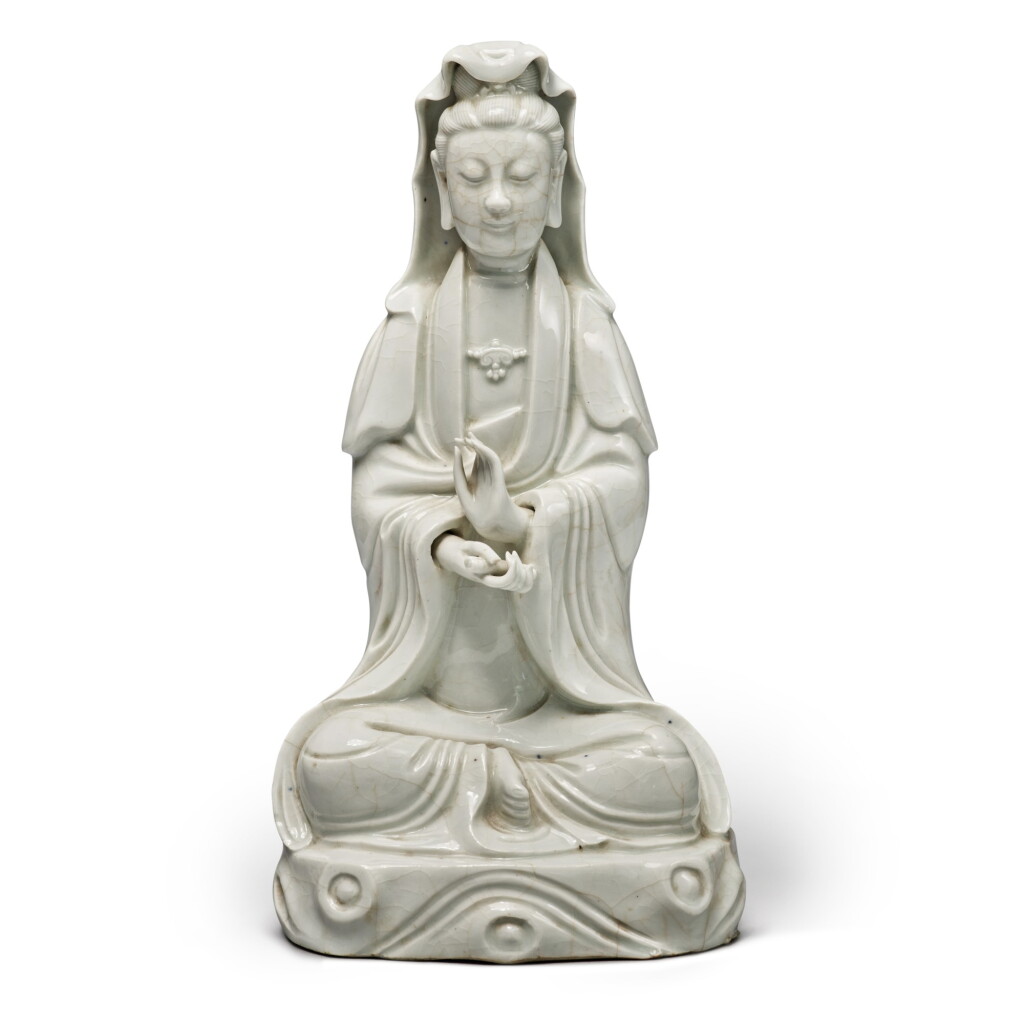 View full screen - View 1 of Lot 637. A 'Dehua' seated figure of Guanyin, Qing dynasty | 清 德化白釉觀音坐像.