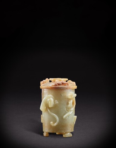View full screen - View 1 of Lot 918. A very rare white and celadon jade 'dragon and phoenix' cup and cover, zhi, Han dynasty | 漢 浮雕螭鳳紋帶蓋玉卮.