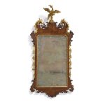 A Fine George II Phoenix-Decorated Parcel-Gilt and Carved Mahogany Looking Glass, Circa 1750
