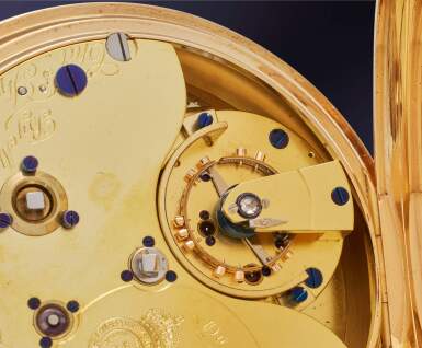 View full screen - View 1 of Lot 46. An exceptionally rare, very large and impressive yellow gold open-faced keyless eight-day pocket chronometer with duo-in-uno hairspring and up-and-down indication, No. 09587, 1915.