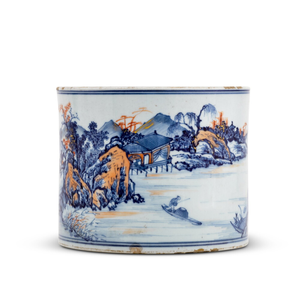 View full screen - View 1 of Lot 82. An underglaze-blue, iron-red and gilt-decorated brush pot, Qing dynasty, 18th century | 清十八世紀 青花礬紅彩描金山水圖筆筒.