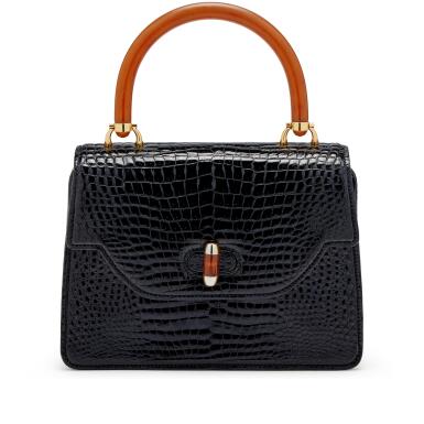 View full screen - View 1 of Lot 1211. Black Crocodile and Bakelite Top Handle Bag Gold Hardware, 1960s.