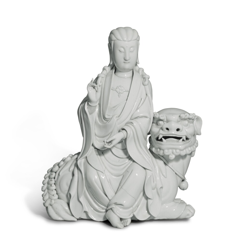 View full screen - View 1 of Lot 320. A 'Dehua' seated figure of Guanyin, Qing dynasty, 18th century | 清十八世紀 德化白釉獅吼觀音像.