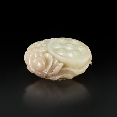 View full screen - View 1 of Lot 3699. A white and brown jade 'lotus' carving, Qing dynasty, 18th century | 清十八世紀 白玉雙連同心.