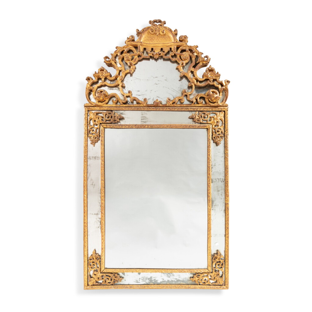 View full screen - View 1 of Lot 273. A giltwood mirror, French Régence, circa 1720 | Grand miroir à parecloses en bois doré d’époque Régence, vers 1720.