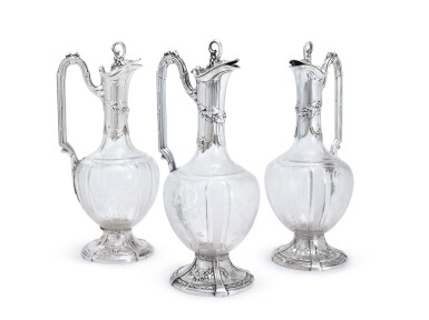 View full screen - View 1 of Lot 340. A SET OF THREE FRENCH SILVER-MOUNTED CUT-GLASS CLARET JUGS, LOUIS COIGNET, PARIS, CIRCA 1890.