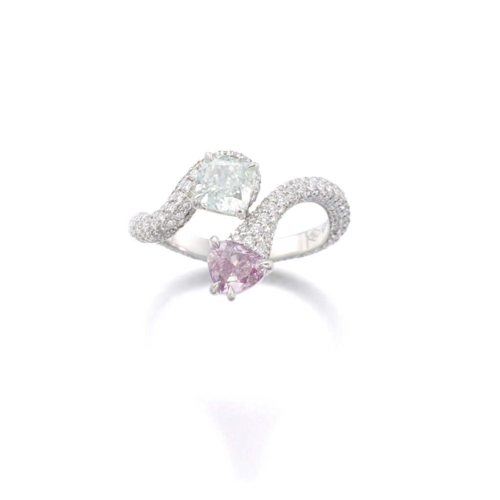 View full screen - View 1 of Lot 411. FANCY LIGHT BLUISH GREEN AND FANCY DEEP PINK-PURPLE DIAMOND RING.