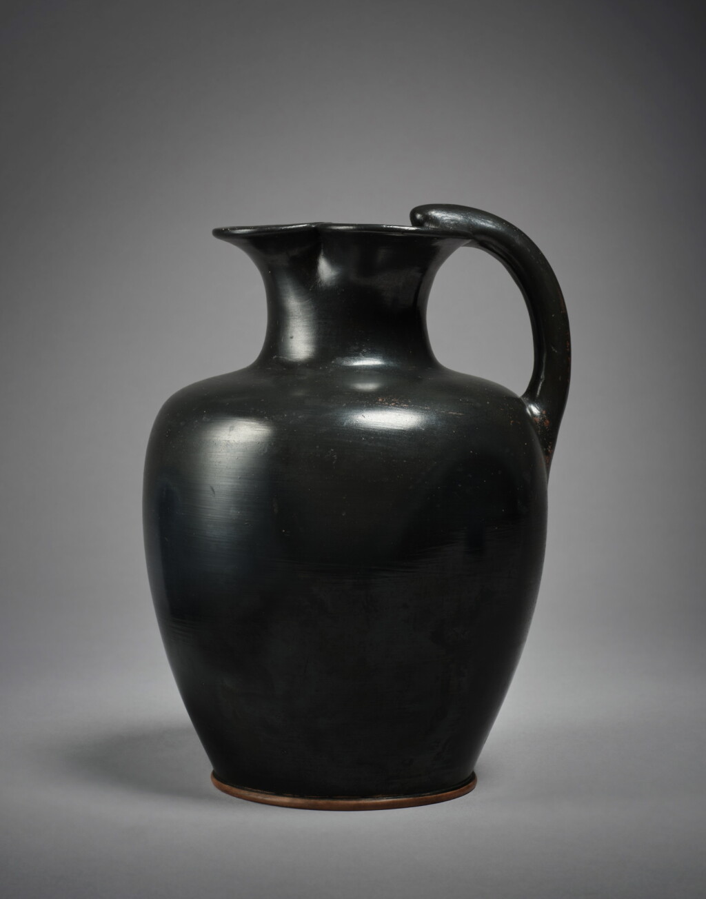 View full screen - View 1 of Lot 302. An Attic Black-Glazed Trefoil Oinochoe, circa mid-5th Century B.C..