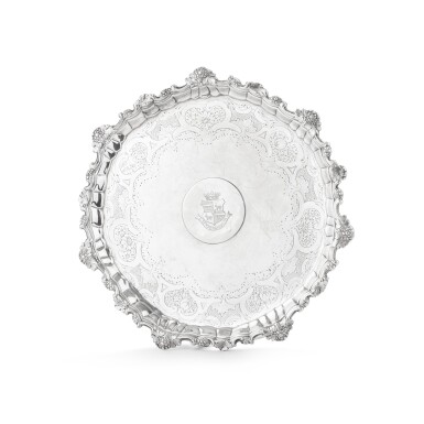 View full screen - View 1 of Lot 491. An English silver circular salver on three feet, William Peaston, London, 1749 | Présentoir rond sur trois pieds en argent par William Peaston, Londres, 1749.