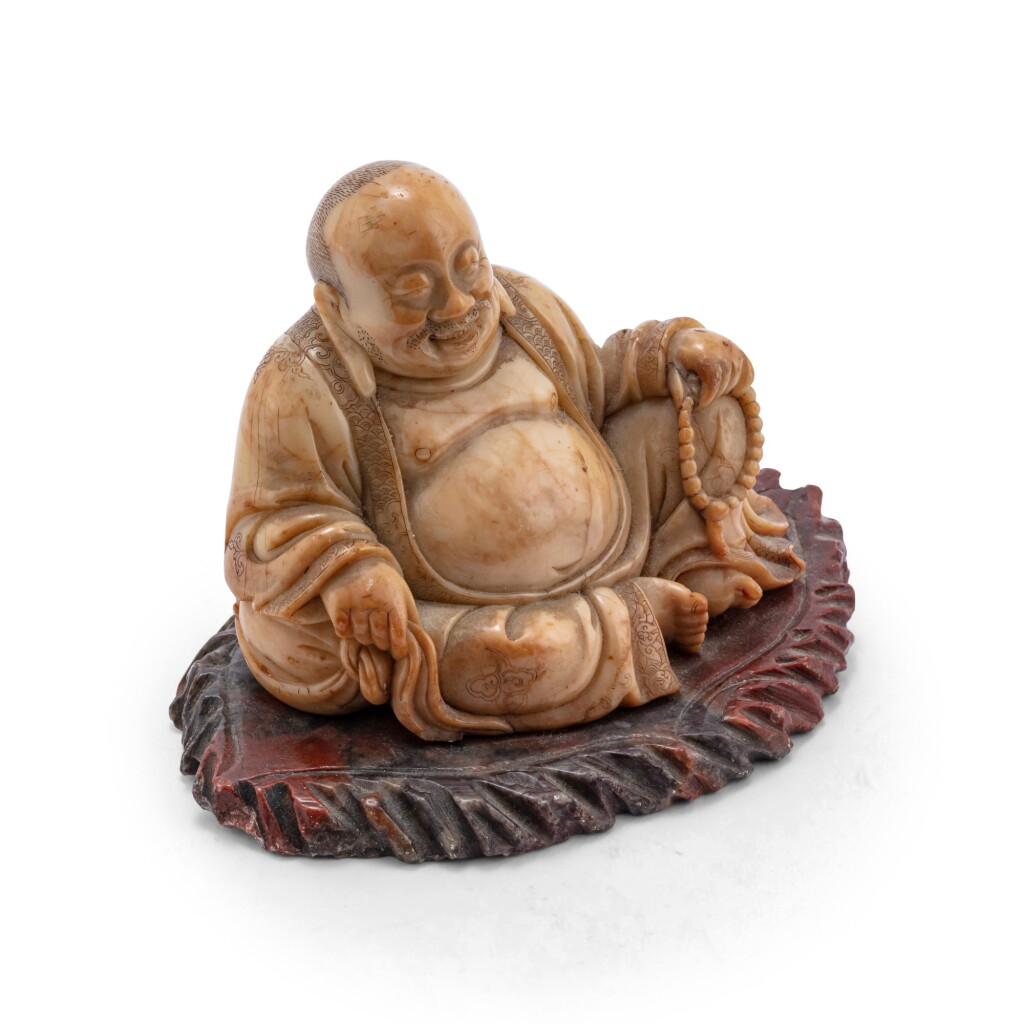 View full screen - View 1 of Lot 158. Statuette de Budai en stéatite Dynastie Qing, XVIIIE siècle | 清十八世紀 壽山石雕布袋和尚坐像 | A soapstone figure of seated budai, Qing Dynasty, 18th century.