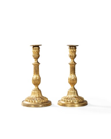 View full screen - View 1 of Lot 46. A pair of gilt-bronze candlesticks, Louis XVI late 18th century | Paire de flambeaux en bronze doré d'époque Louis XVI, fin du XVIIIe siècle.