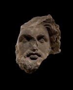 A HELLENISTIC MARBLE HEAD OF A BEARDED GOD, CIRCA 3RD CENTURY B.C.