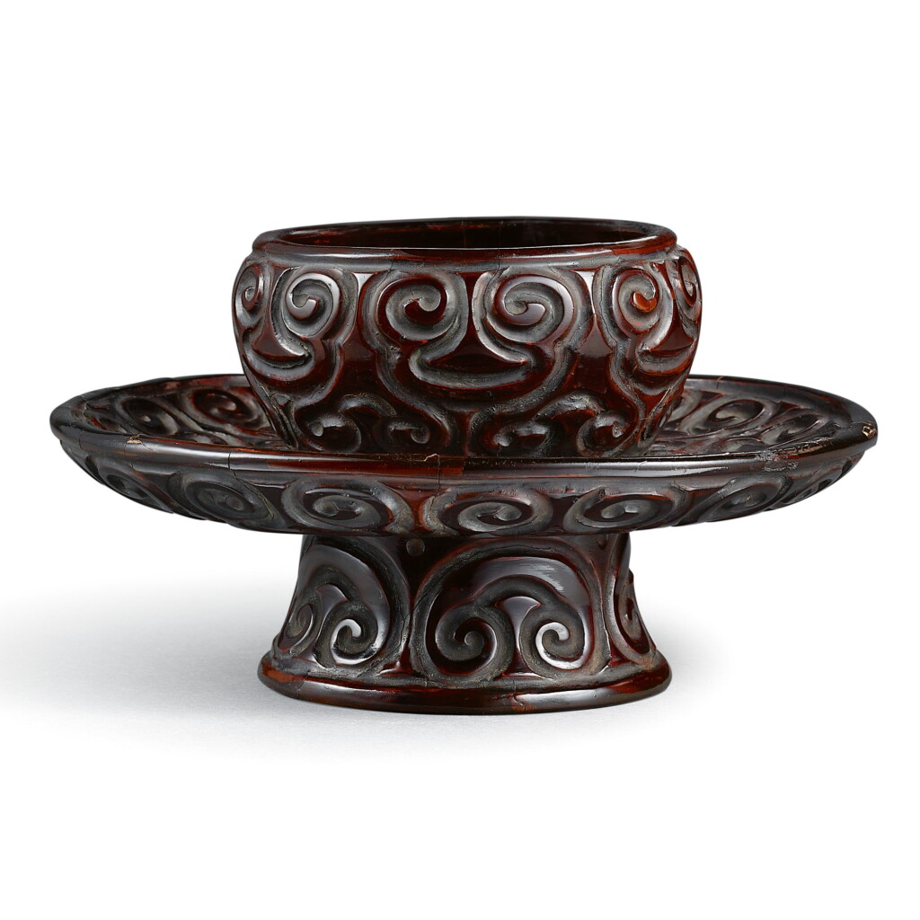 View full screen - View 1 of Lot 50. A BLACK 'TIXI' LACQUER CUP STAND MING DYNASTY | 明 烏面剔犀盞托.
