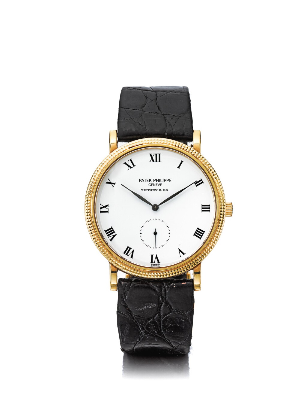 View full screen - View 1 of Lot 124. PATEK PHILIPPE | REFERENCE 3919J RETAILED BY TIFFANY & CO: A YELLOW GOLD WRISTWATCH, CIRCA 2000.