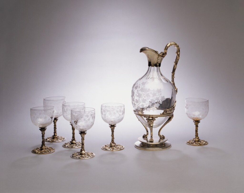 View full screen - View 1 of Lot 340. Astor Family: An American Silver-Mounted Claret Jug and Six Matching Glasses, Edward C. Moore for Tiffany & Co., New York, Circa 1863-64.