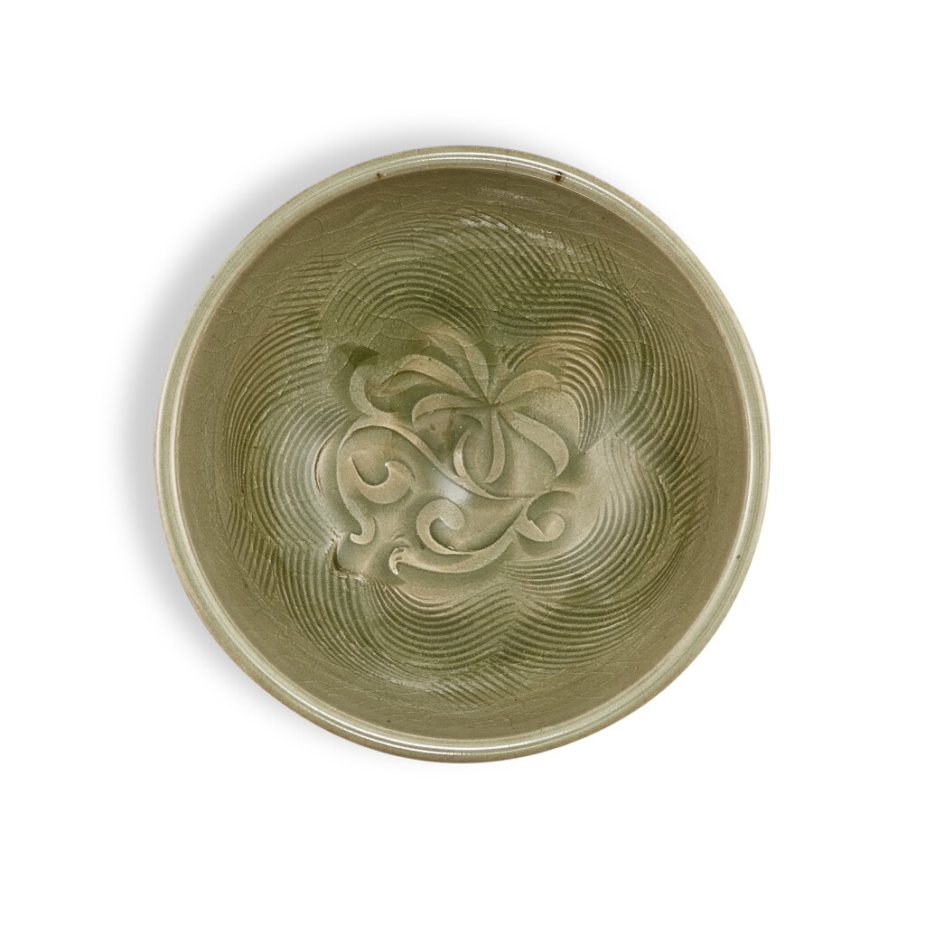 View full screen - View 1 of Lot 3531. A finely carved Yaozhou celadon 'floral' bowl, Northern Song dynasty | 北宋 耀州青釉刻花盌.