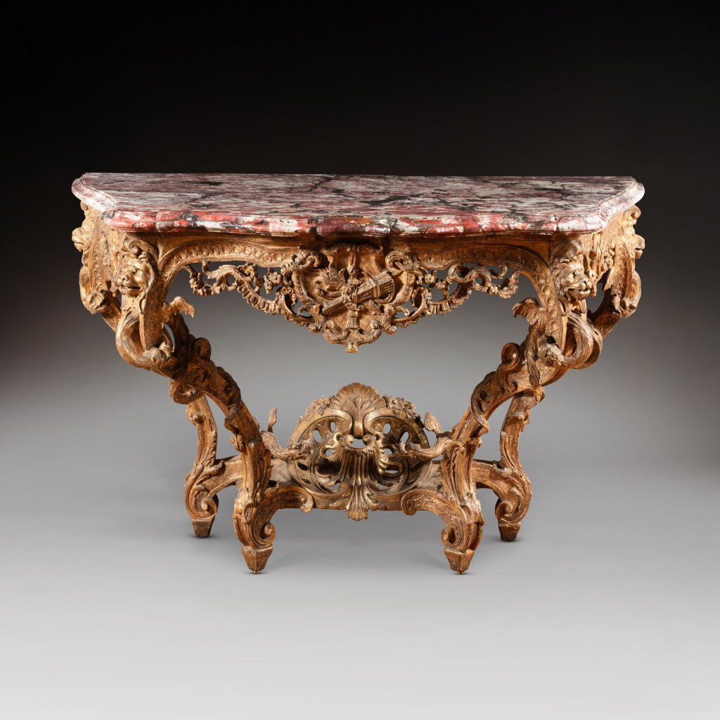 View full screen - View 1 of Lot 61. A Régence giltwood console table, circa 1720, in the taste of Nicolas Pineau.
