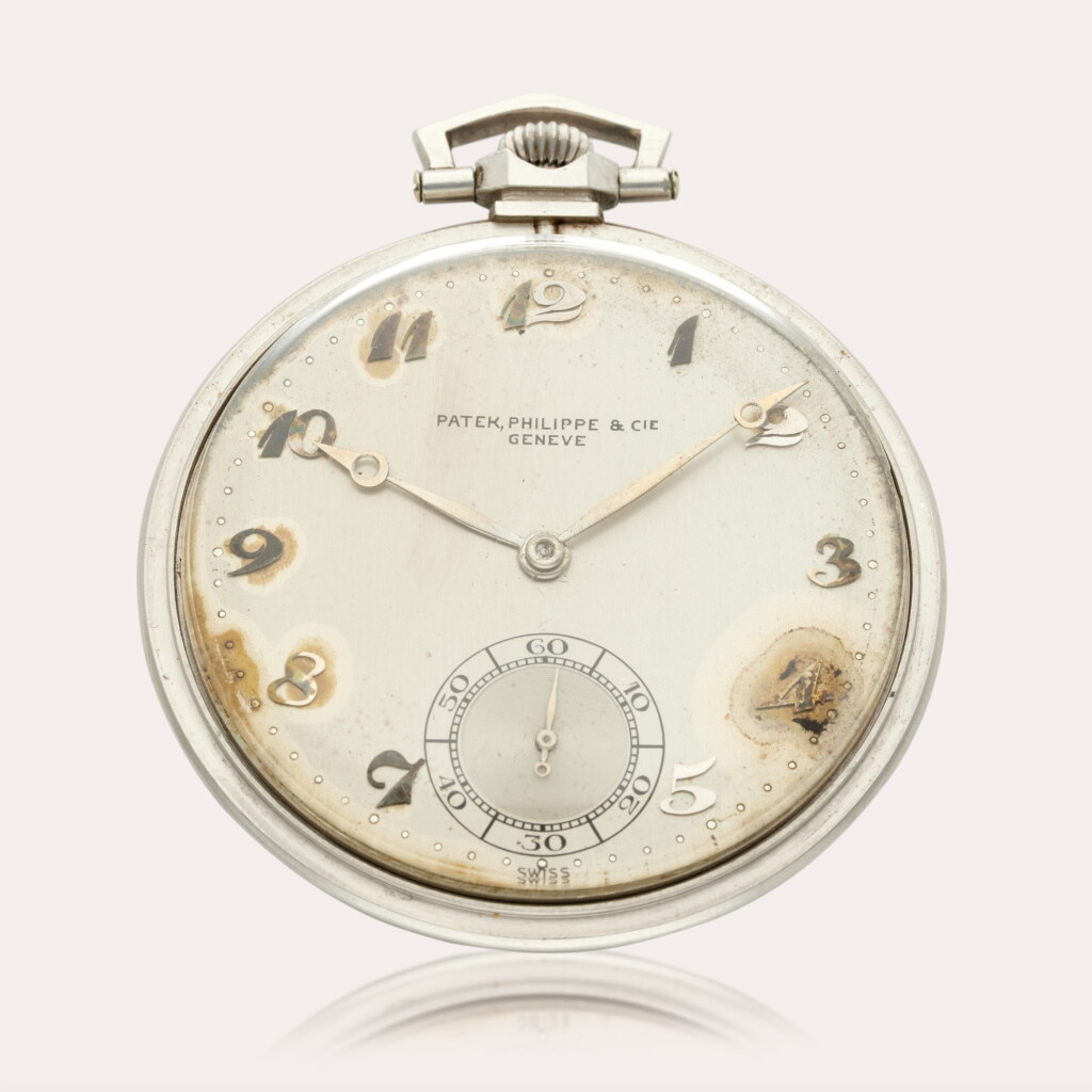 View full screen - View 1 of Lot 430. A platinum open faced watch, Circa 1945.