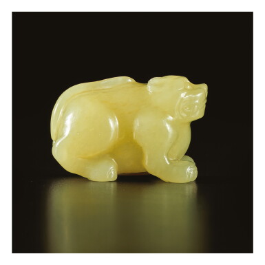 View full screen - View 1 of Lot 678. A CARVED YELLOW JADE FIGURE OF A MYTHICAL BEAST, YUAN / MING DYNASTY.